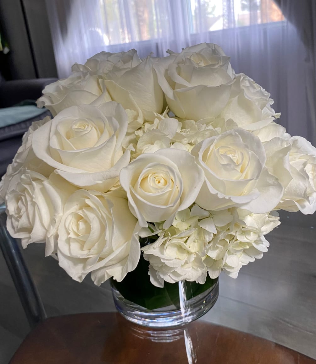 24 roses and 2 hydrangeas all white arrangement
