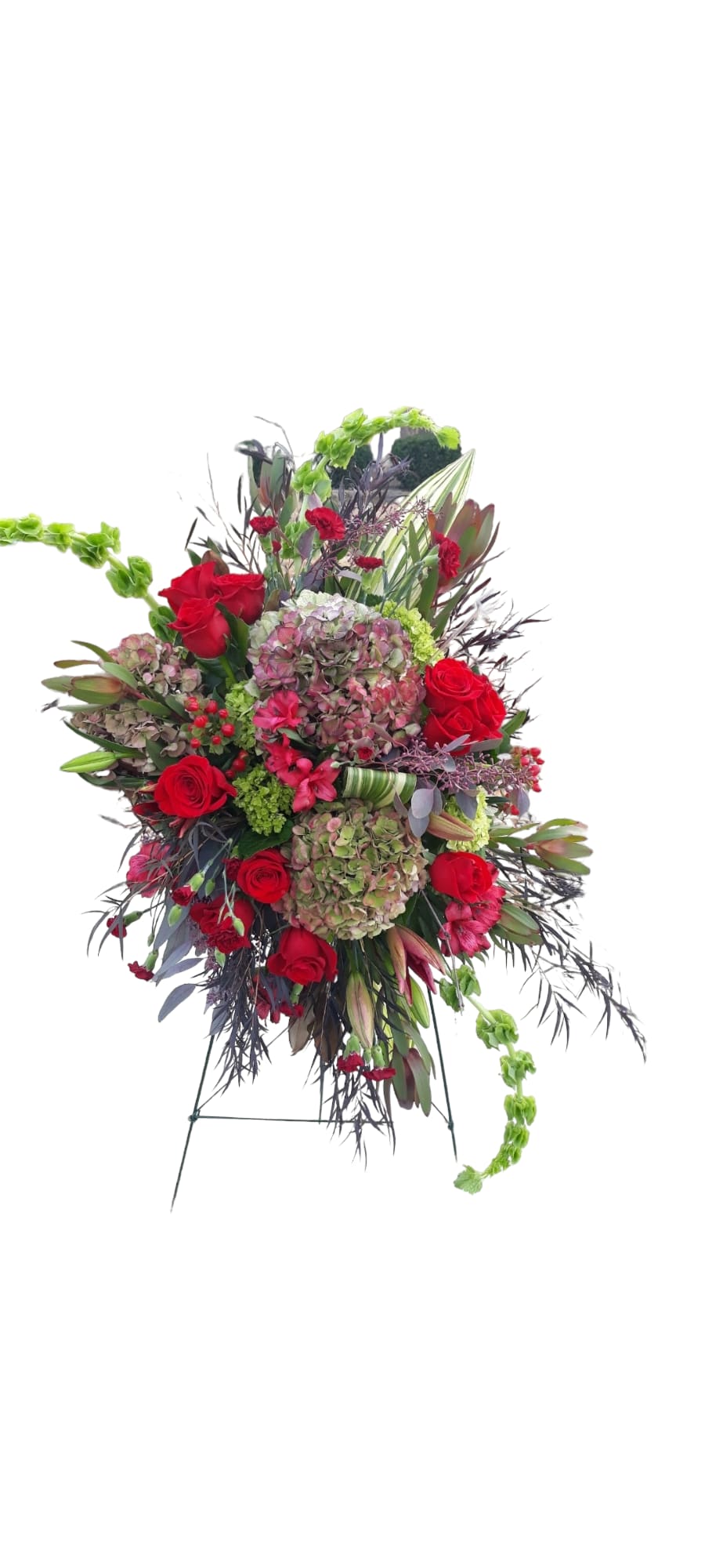 Stunning easel adorn with the freshest red blooms.