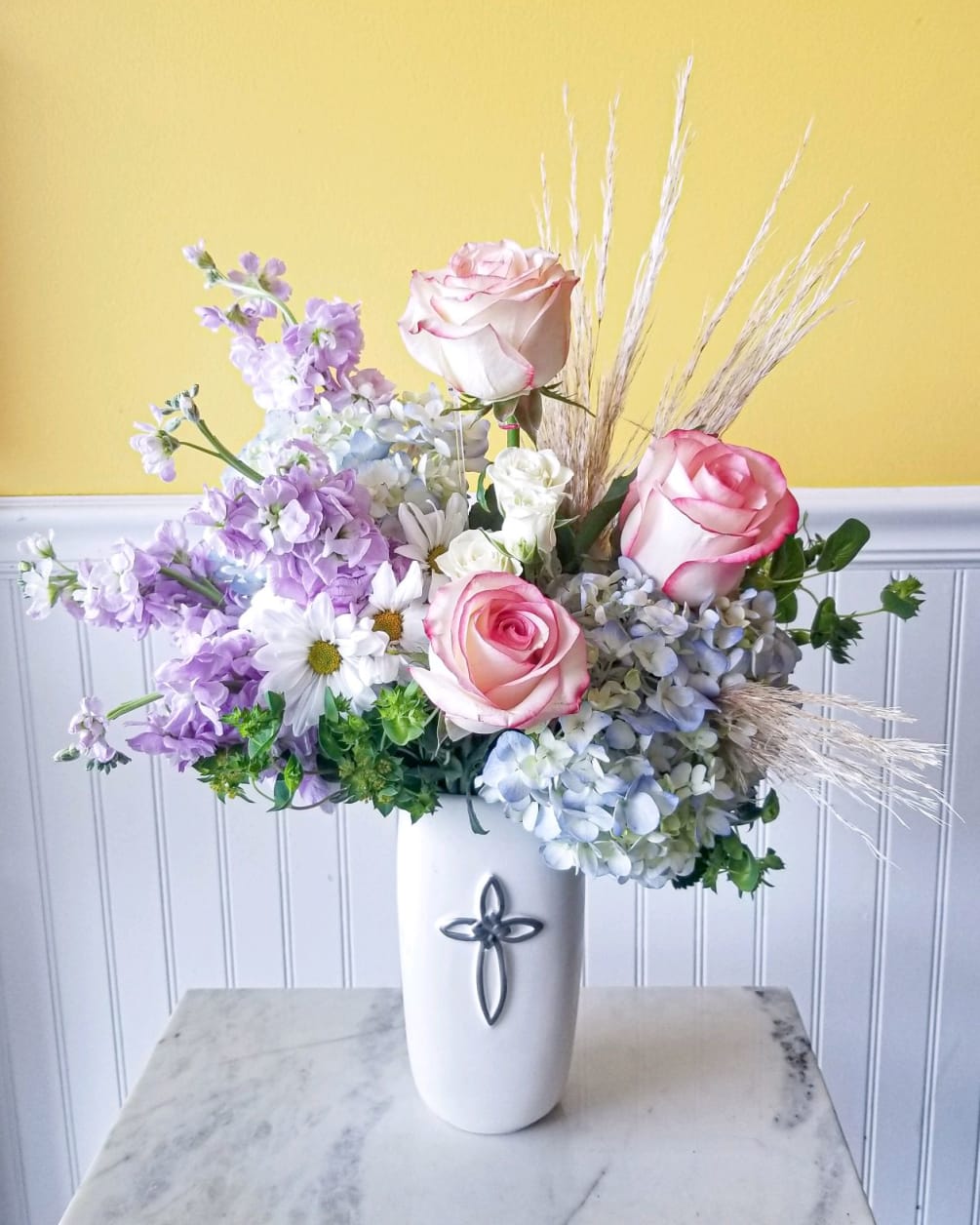 Timeless beauty abounds in this arrangement of Purple stock and soft pinks