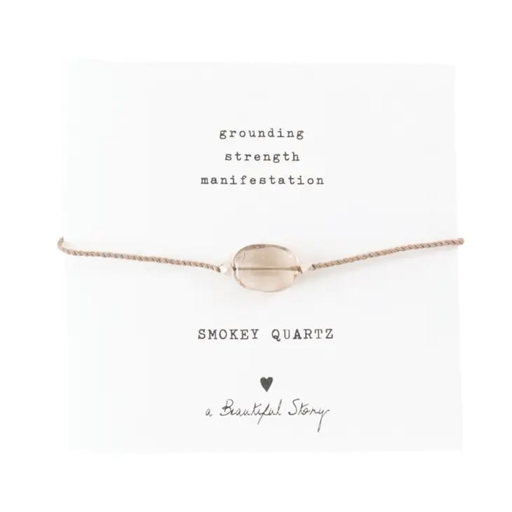 This bracelet is made of a cotton thread and a smokey quartz