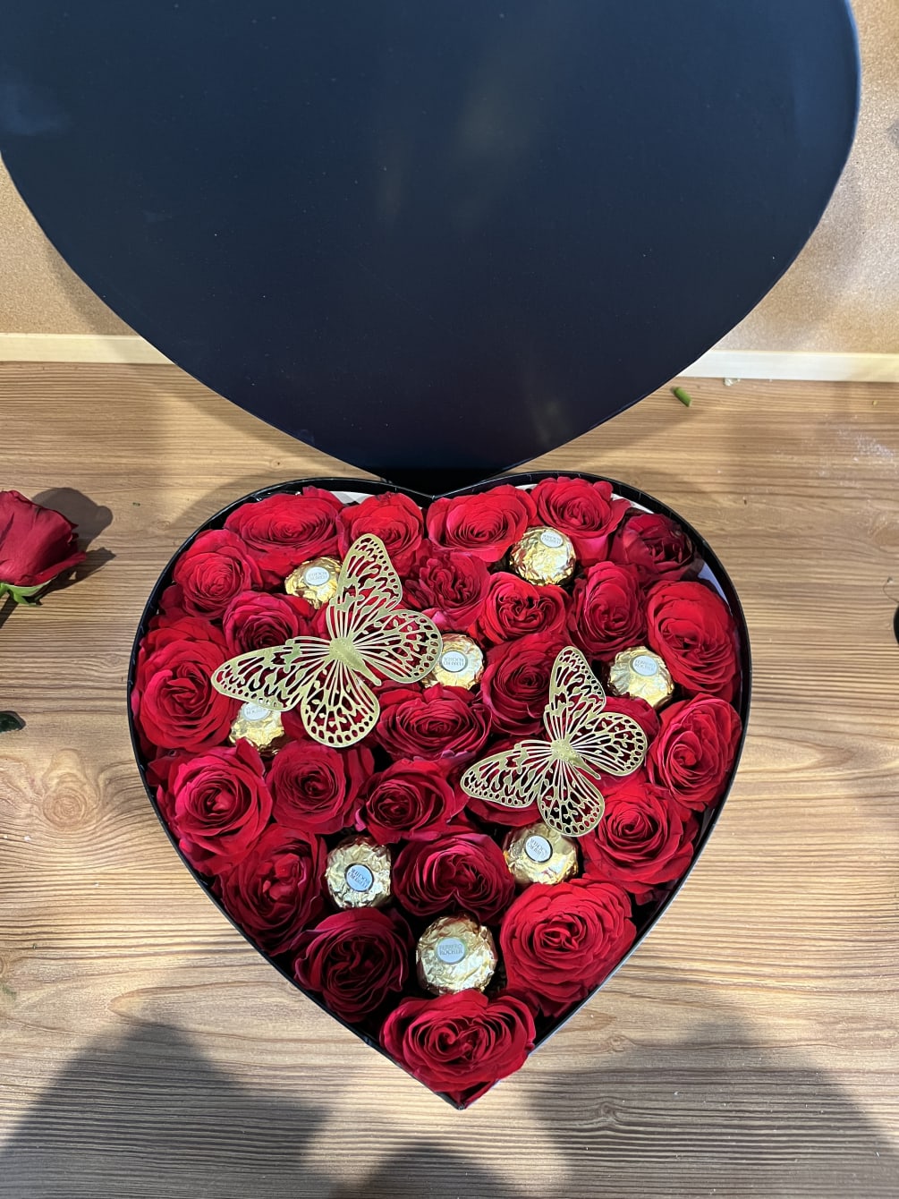 Medium heart shape black box with red roses and add on butterflies