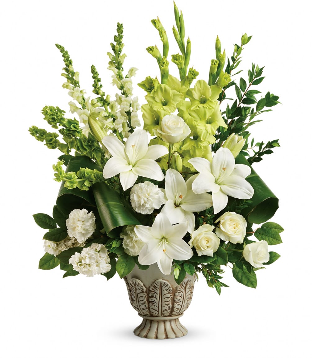 Peaceful and majestic in a large antiqued pot, this wondrous white arrangement