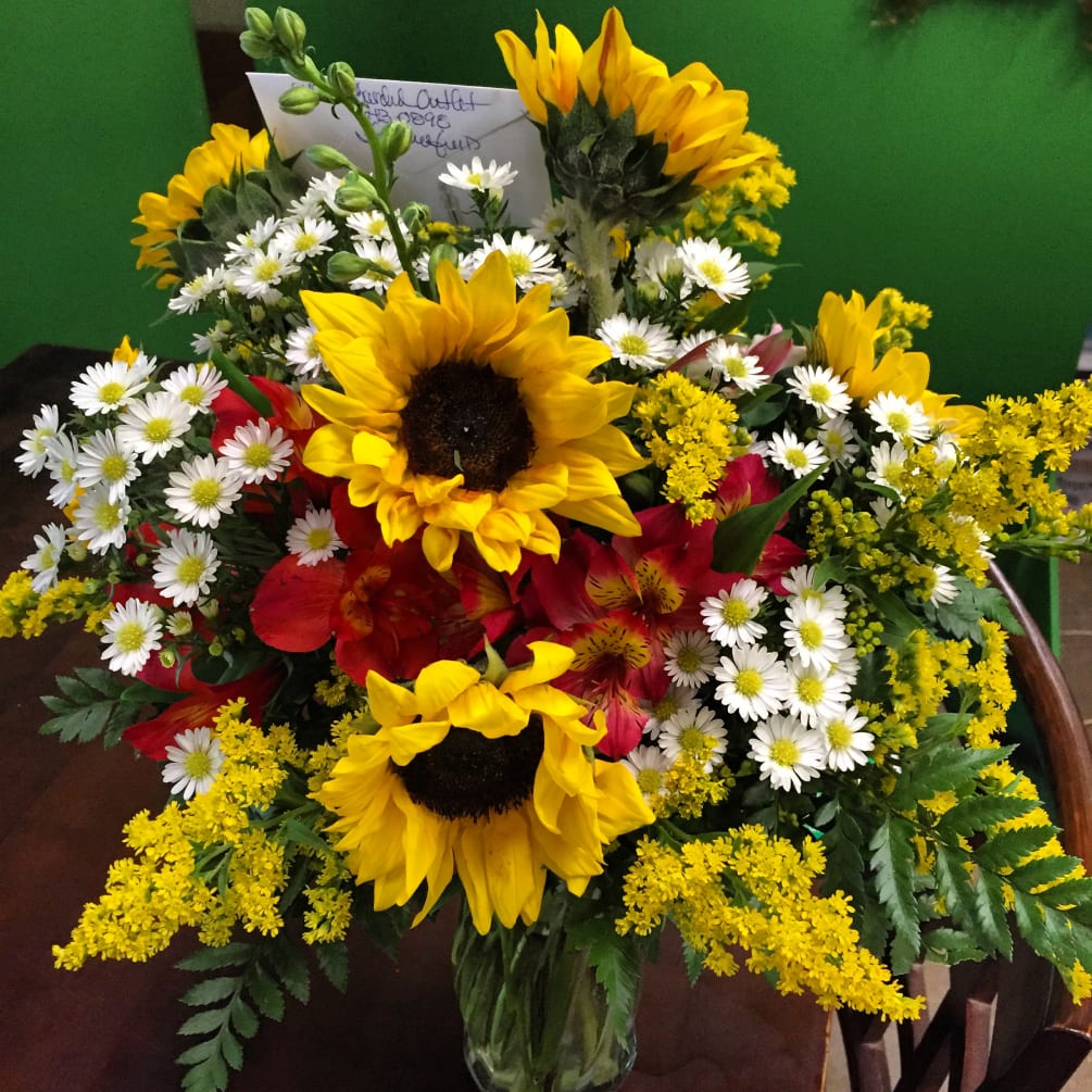 Nothing says country arrangement then sunflowers. Sunflowers are fun and cheerful way