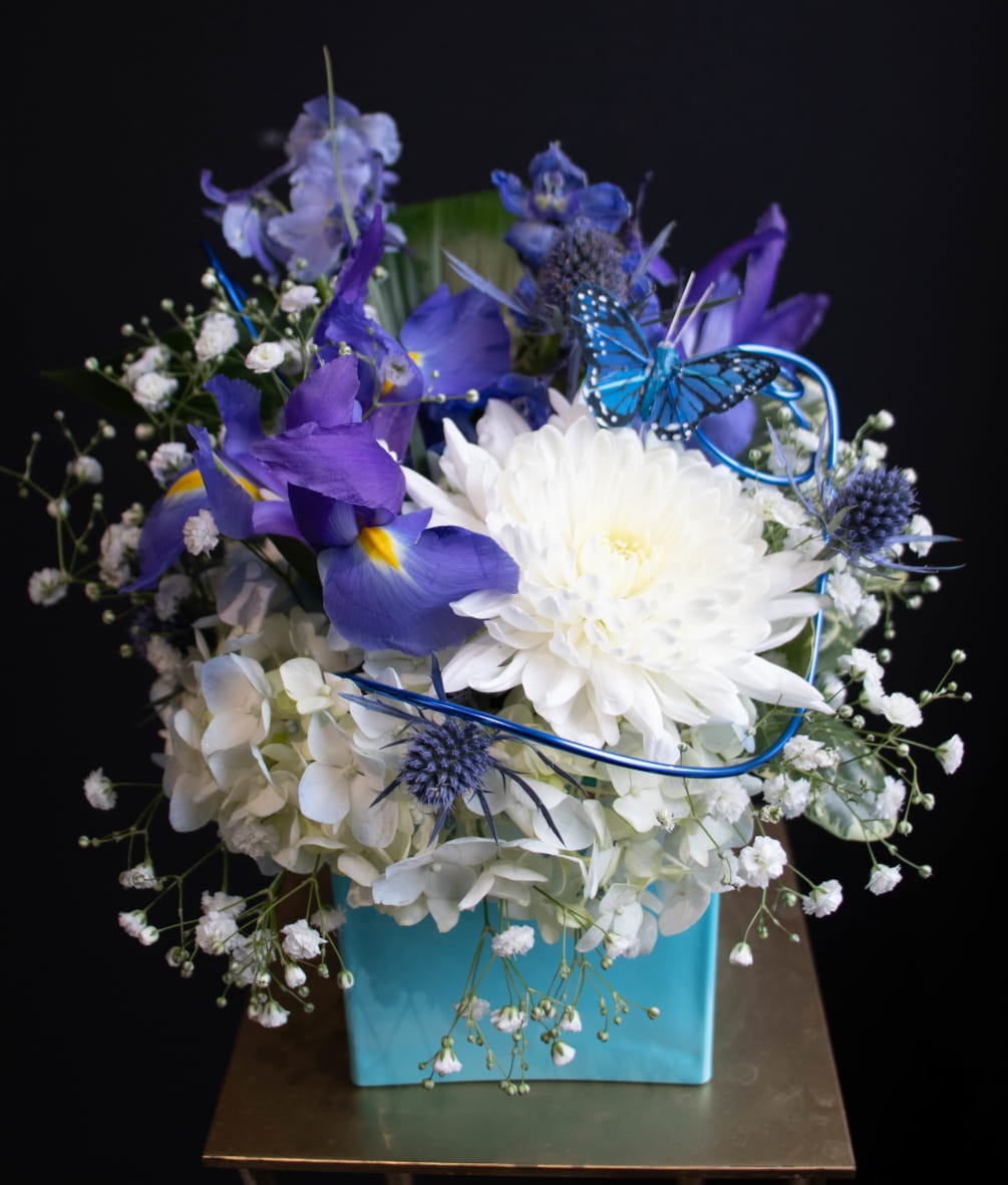 A small sweet arrangement in a robin egg blue vase to help