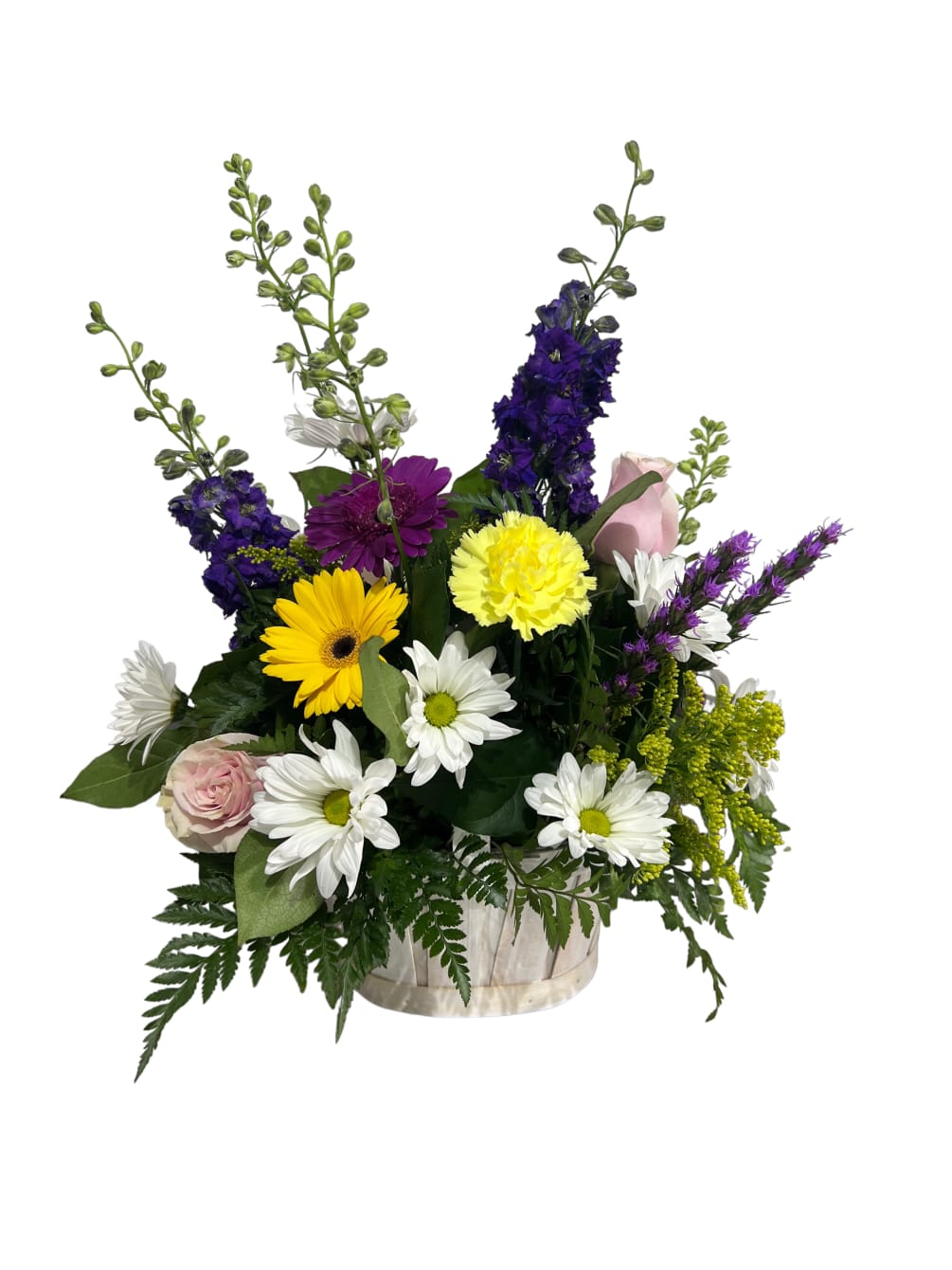 Fresh assortment of blooms arranged in a basket, using larkspur, gerbera daisies