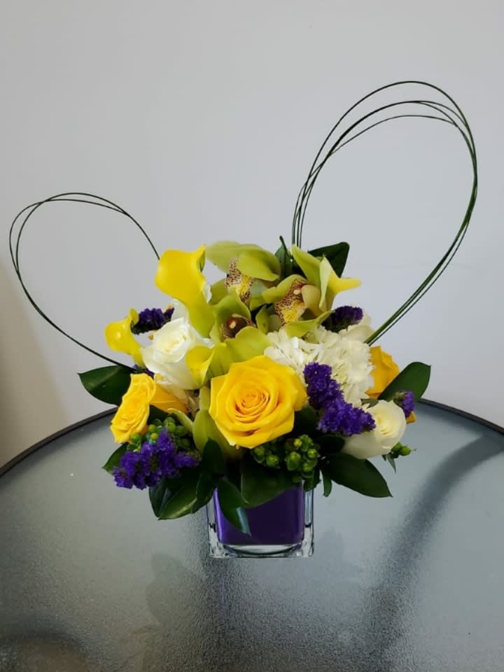 Beautiful blue crystal vase with yellow roses, callas and orchids, A perfect