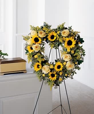 Sunflower, roses, and carnations are used to create a brilliant expression of