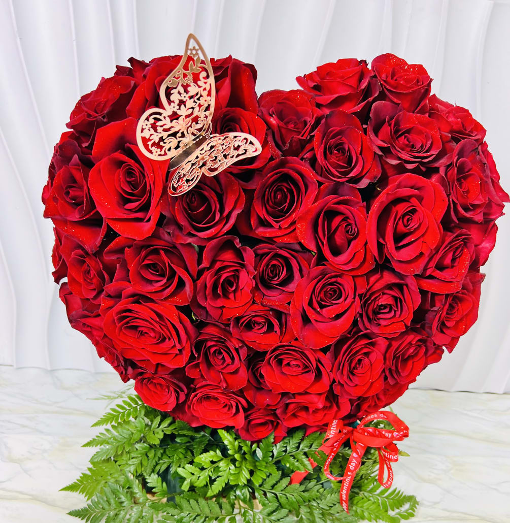 This stunning design has 4 dozen red roses, a grand gesture to