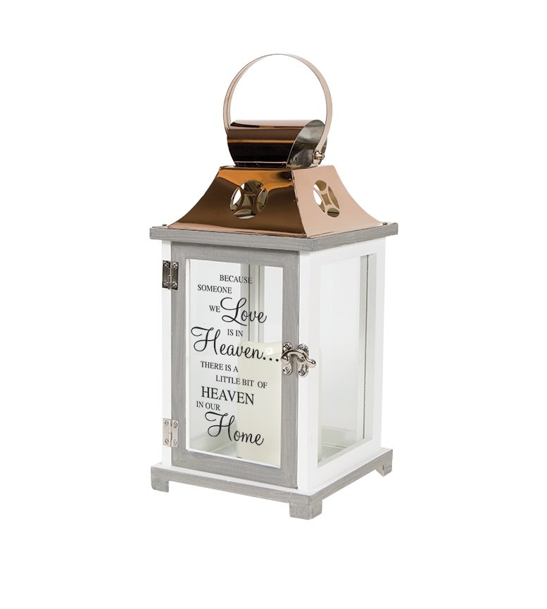 This decorative keepsake lantern reads &quot;Because someone we love is in Heaven