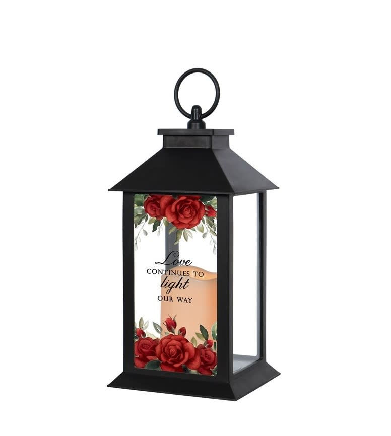 This lantern reads &quot;Love continues to light our way&quot;. These lanterns are