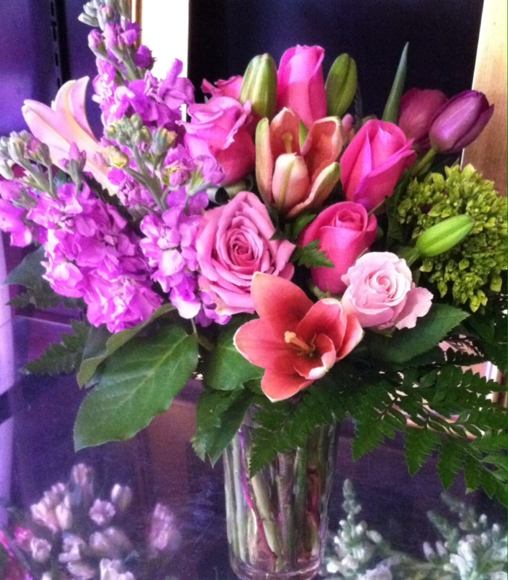 Pink and lavender blooms of roses and lilies with tulips and hydrangea