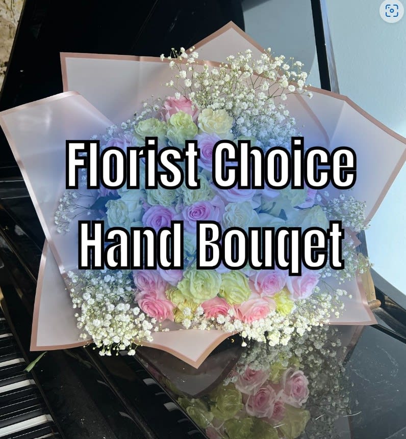 Florist choice hand wrapped arrangement. If there is a color scheme you