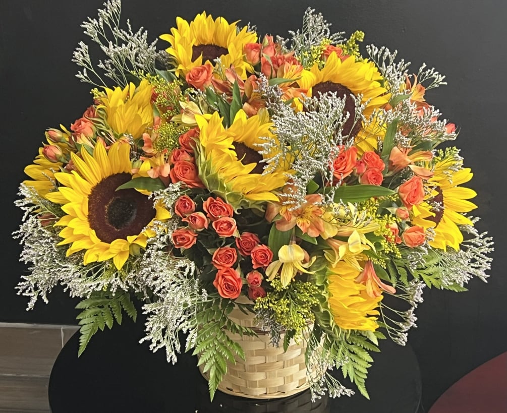 Sunflowers, Yellow Astromelias, Spray orange Roses,Limonion, Foliage and Basket