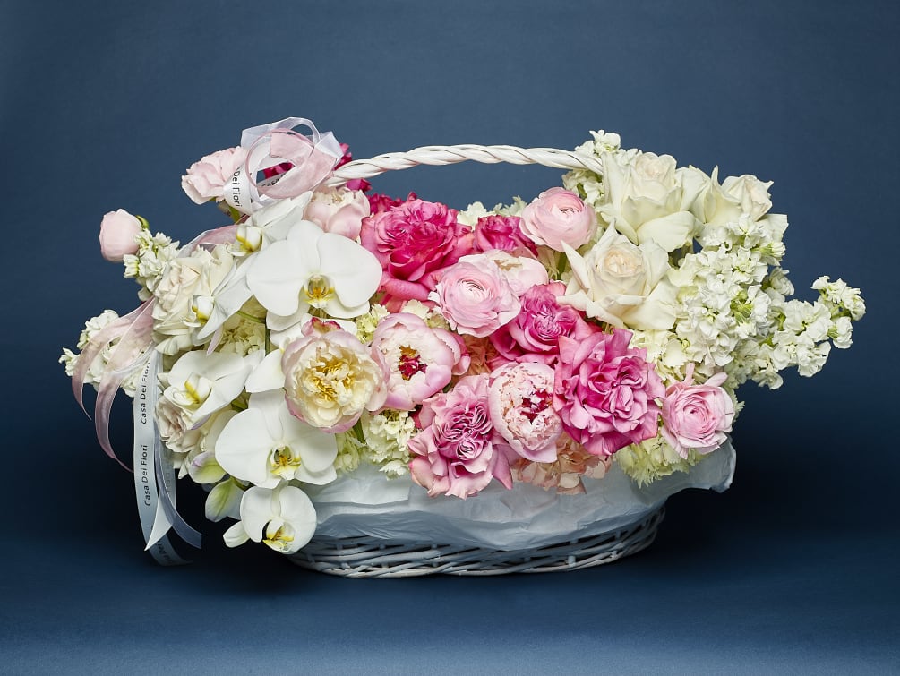 Peonies, hydrangeas and orchids arranged in a basket. Size Large
