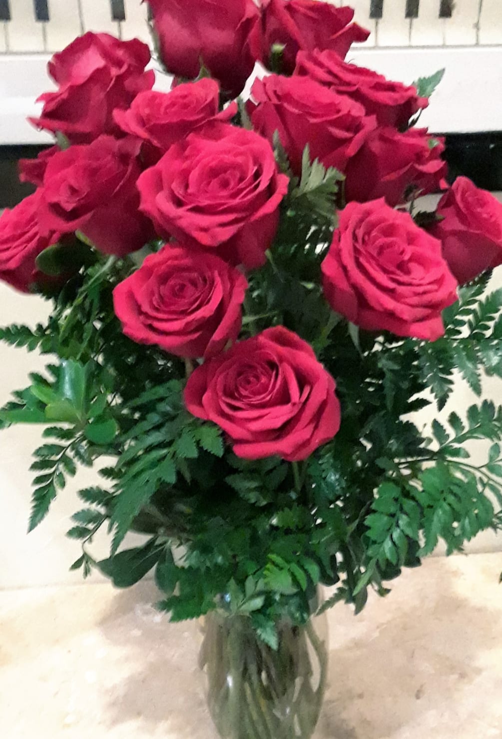 Order gorgeous red roses in red vase. Choose from 12, 18, or