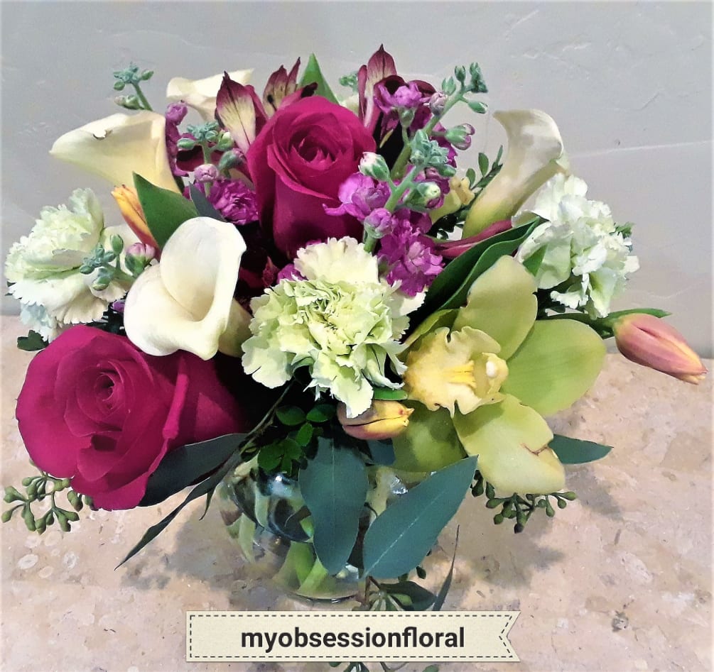 Bubble bowl arrangement with premium flowers, is great for any occasion. We