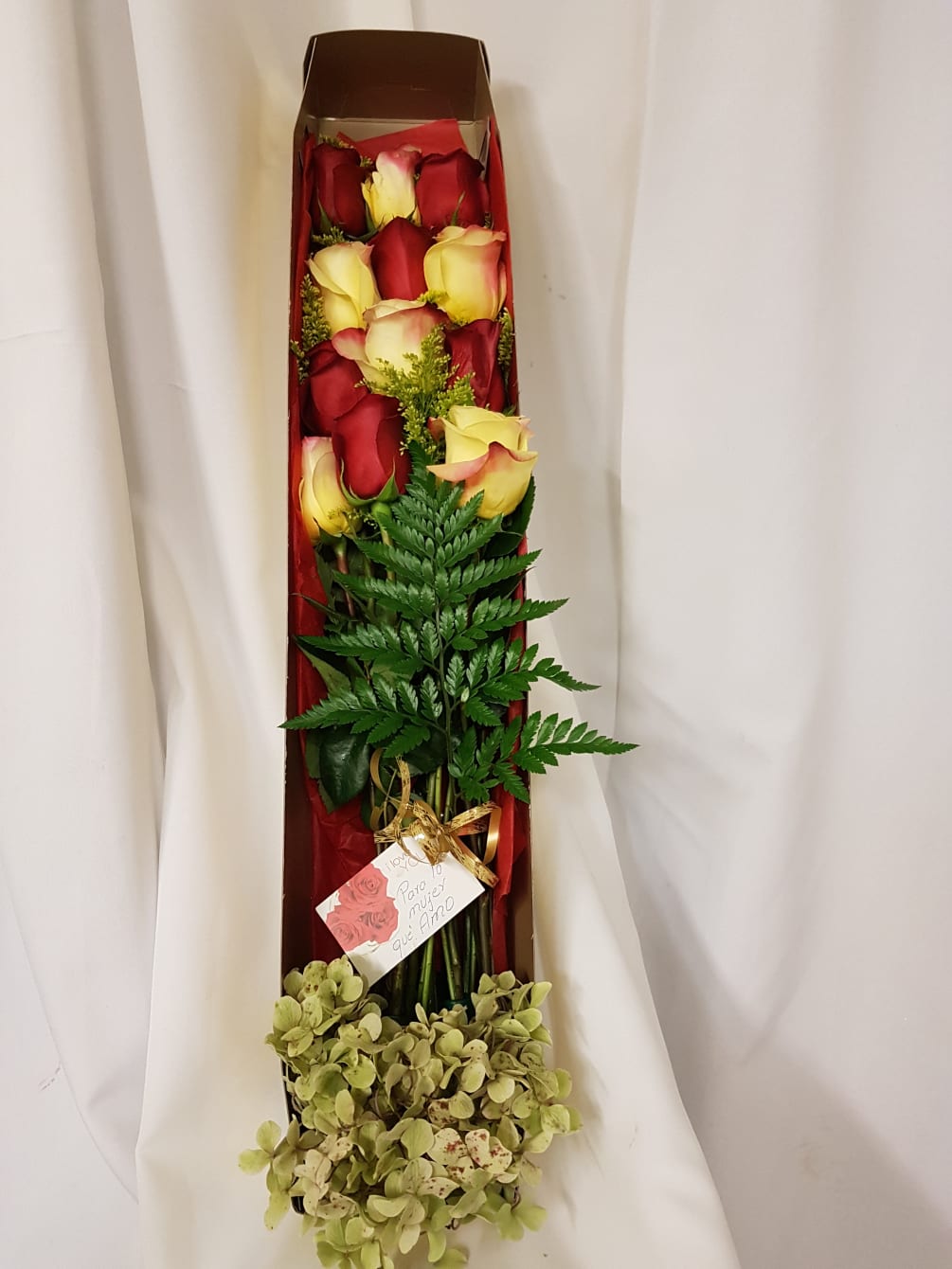 A simple yet elegant dozen roses placed in a box for a