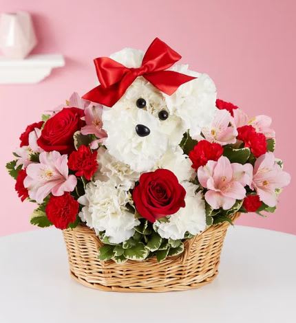 Talk about puppy love! Crafted from lasting white carnations, our canine cutie