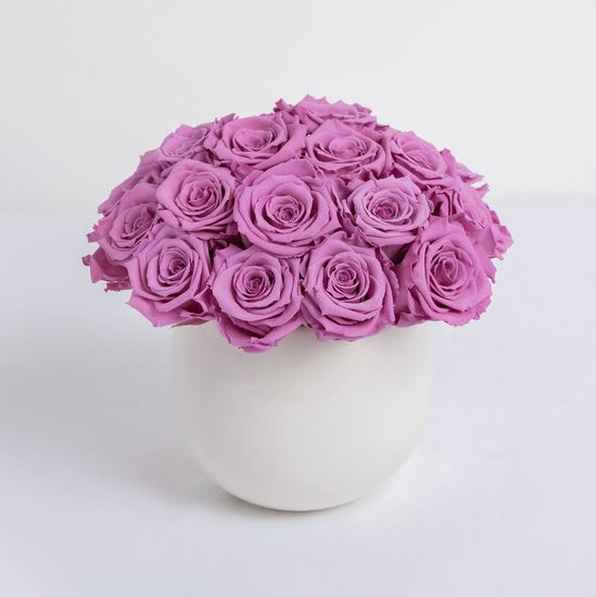 Our Classic Preserved Rose Composition includes 20 beautifully lavender preserved roses hand-crafted