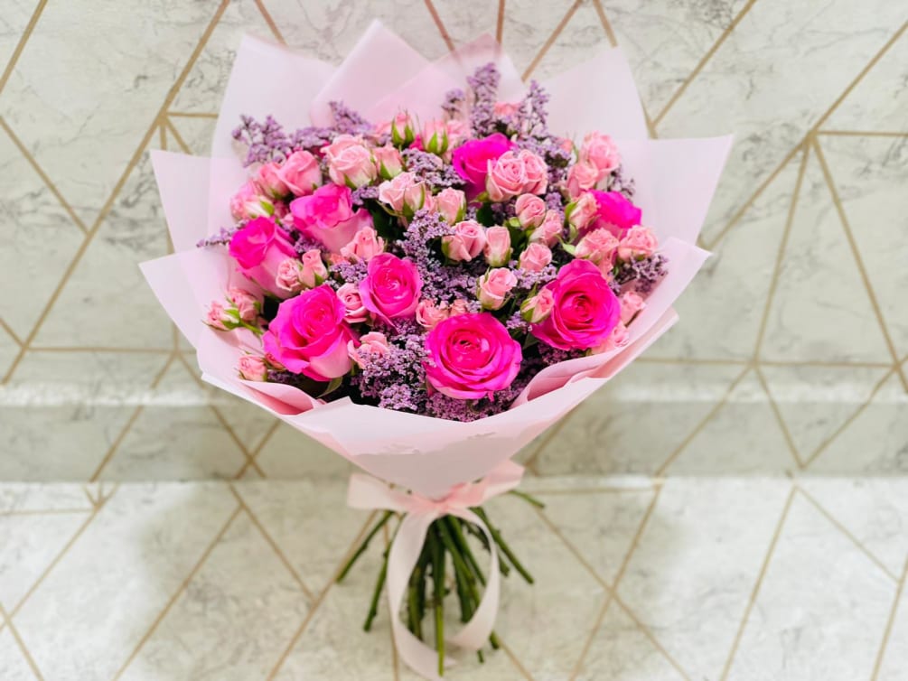 pink and purple mixed floweers beautifully put together as a bouquet. please