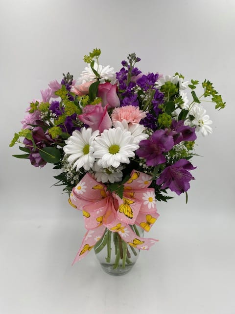 MIXED ARRANGEMENT IN A 8&quot; CLEAR VASE WITH ROSES, ALSTRO, DAISIES, STOCK
