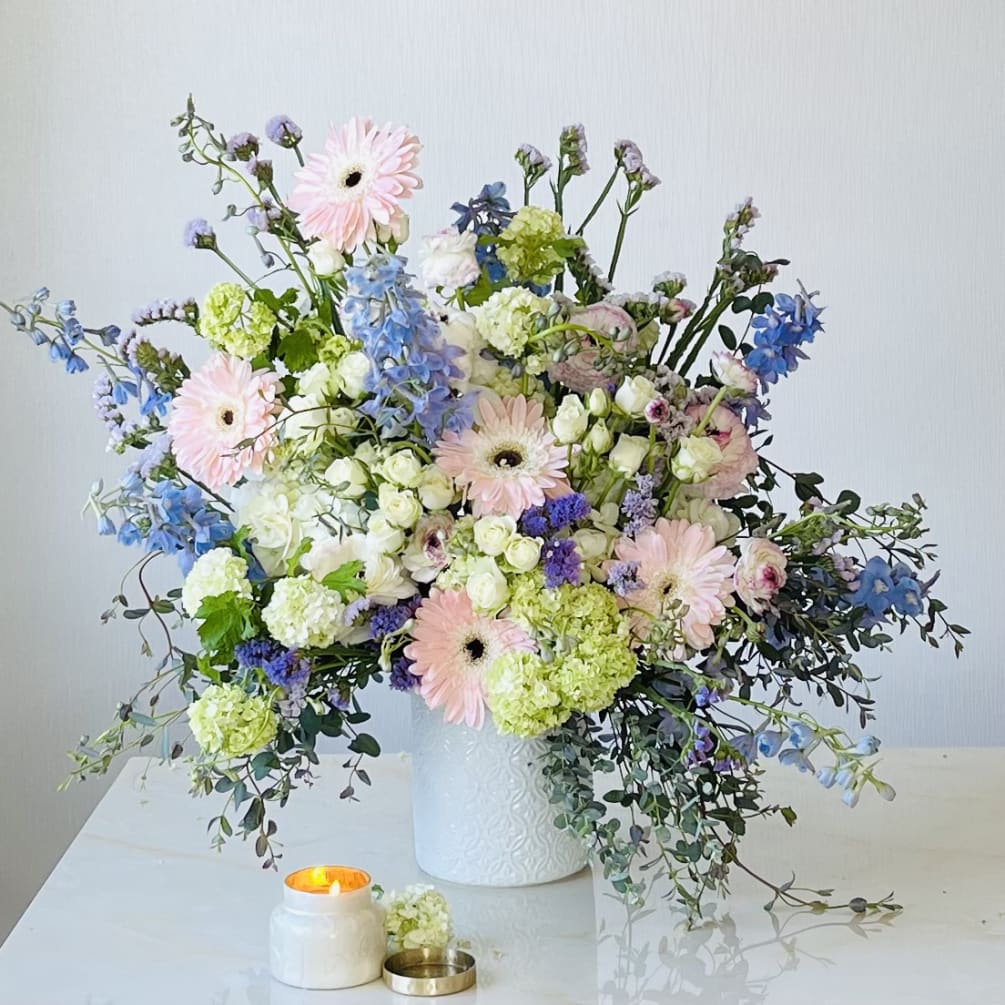 The Blue Spring flower arrangement reflects the floral bounty and beauty of