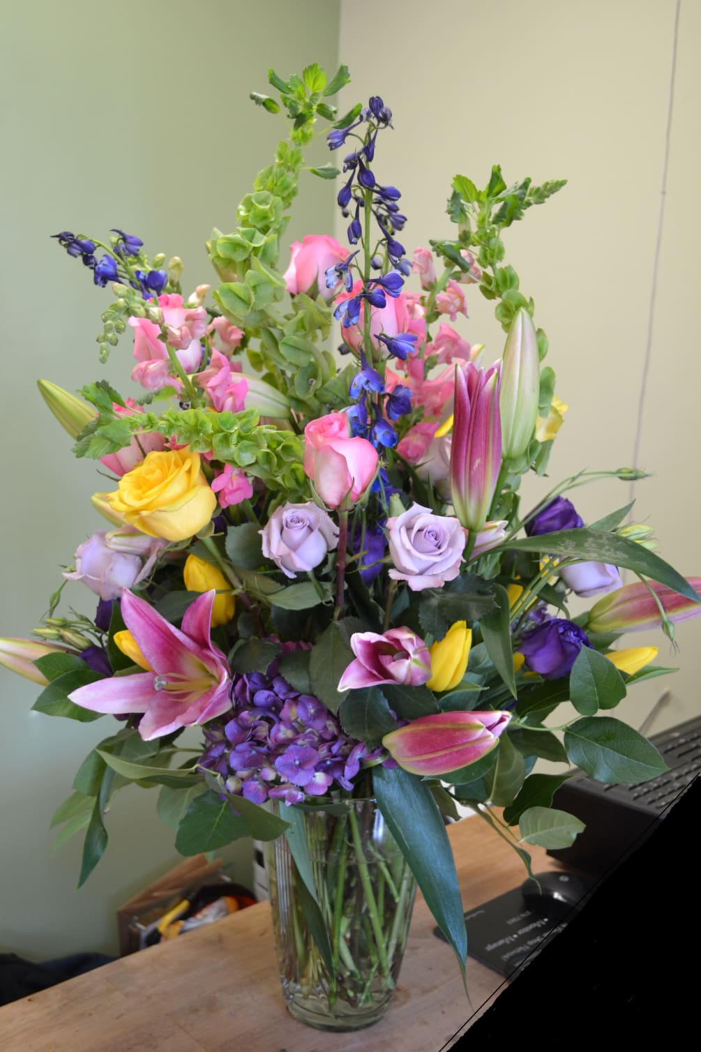 Oriental Lilies, Tulips, Roses, Bells of Ireland, Delphinium, Snapdragons, Hydrengea and more