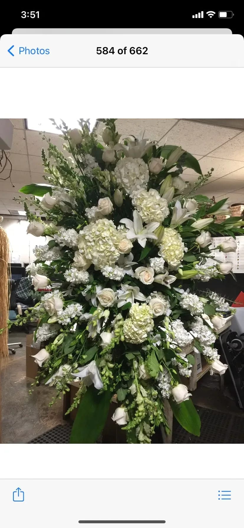 Tall standing spray of Roses, lilies, hydrangea, and premium white Flowers appropriate
