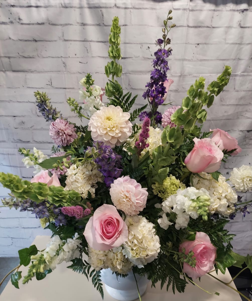 A simple and elegant pastel arrangement that offers peace and tranquility to