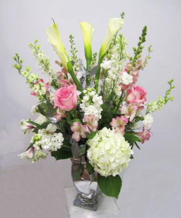 Silver anniversary arrangement with Hydrangea, roses, calla lilies, carnations, larkspur, alstroemeria, snapdragons