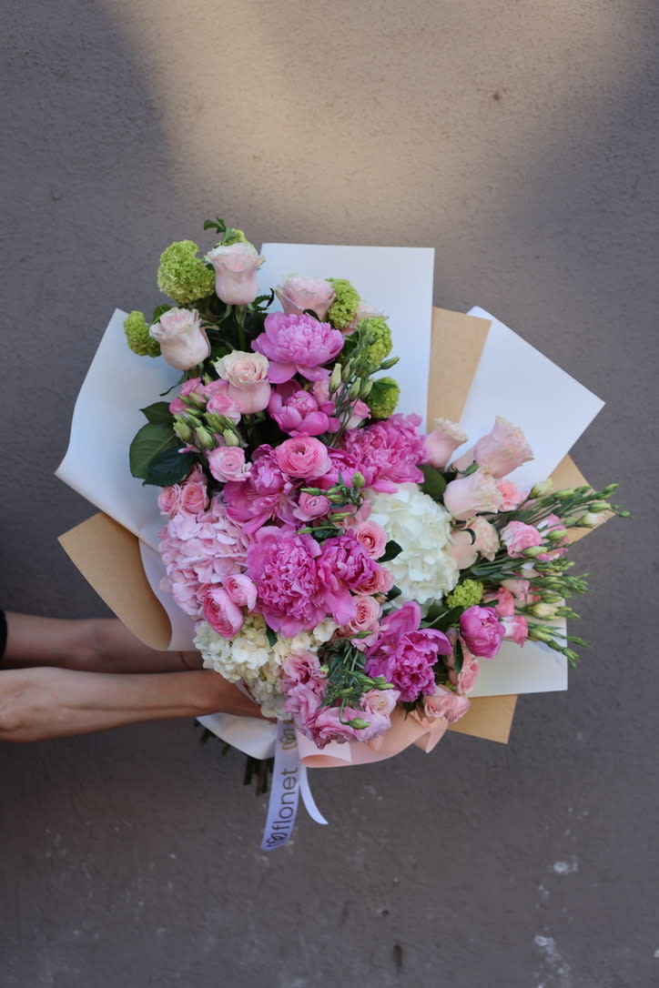 This bouquet is a beautiful blend of pink and white hues, featuring
