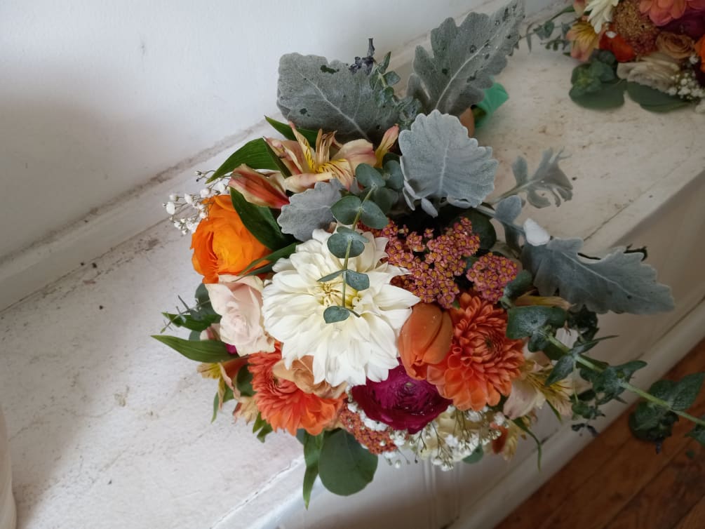 Beautiful fall colors dahlia, roses, alstroemeria and other flowers round posy bridesmaids