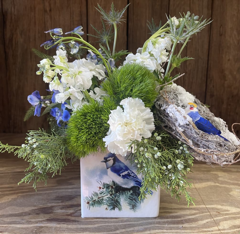 Chase away the winter blues with this sweet little arrangement.  Brighten