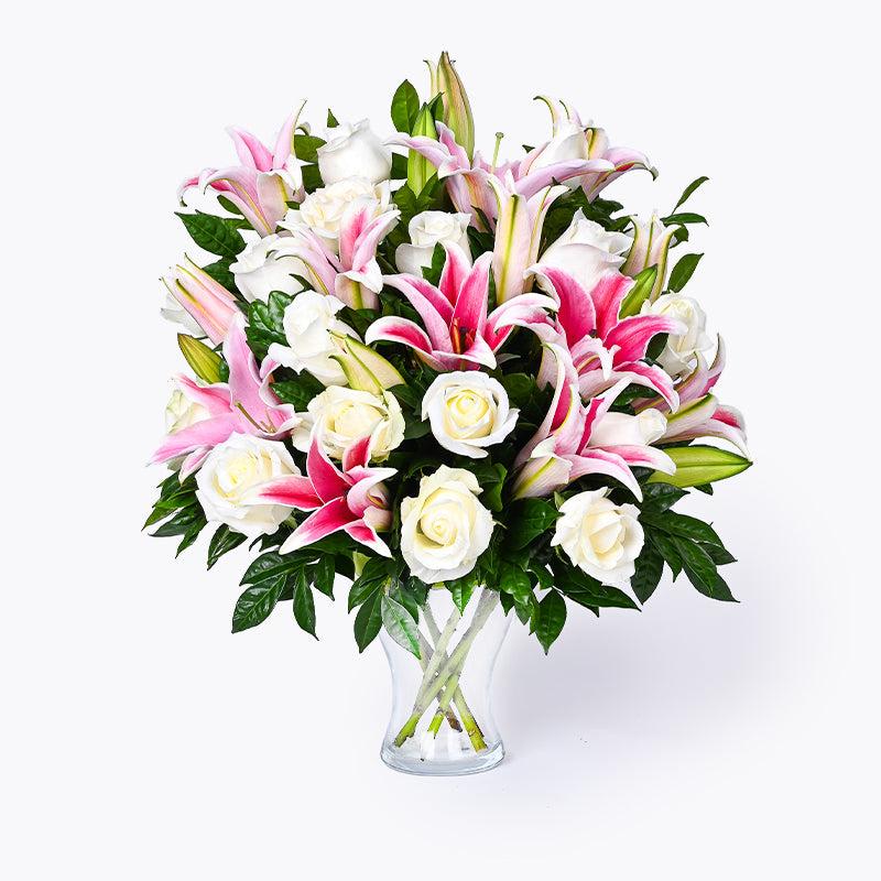 Fragrance arrangement, lilies, alstroemerias, eucalyptus, complemented with white roses; resulting in a