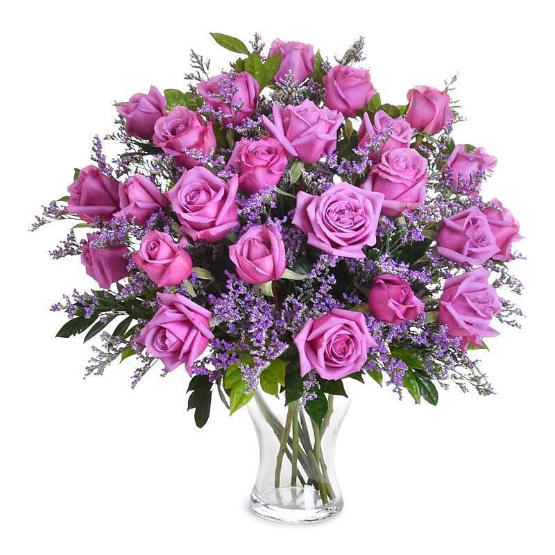 Beautiful arrangement of vibrant violet roses for that person who deserves everything.