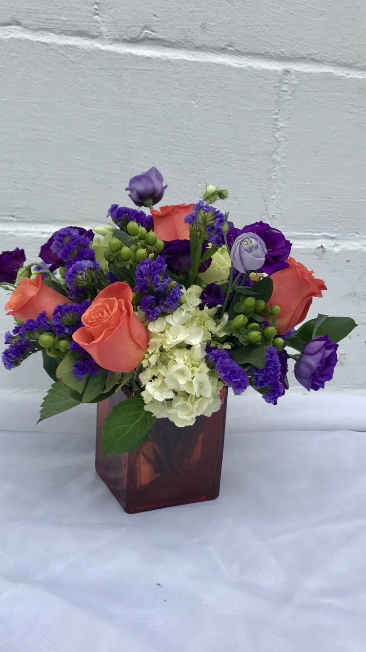 Cube compact bright arrangement with purple green and orange 