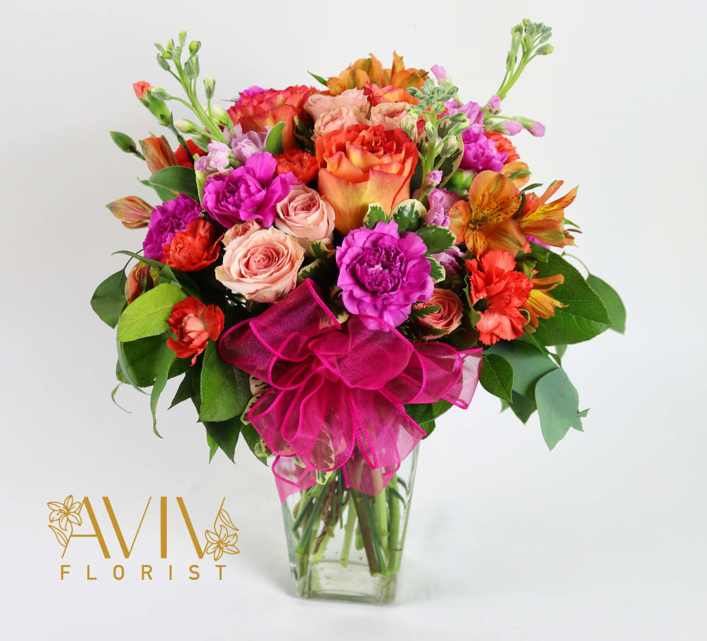 Celebrate good times with this lively bouquet. The arrangement includes roses, carnations