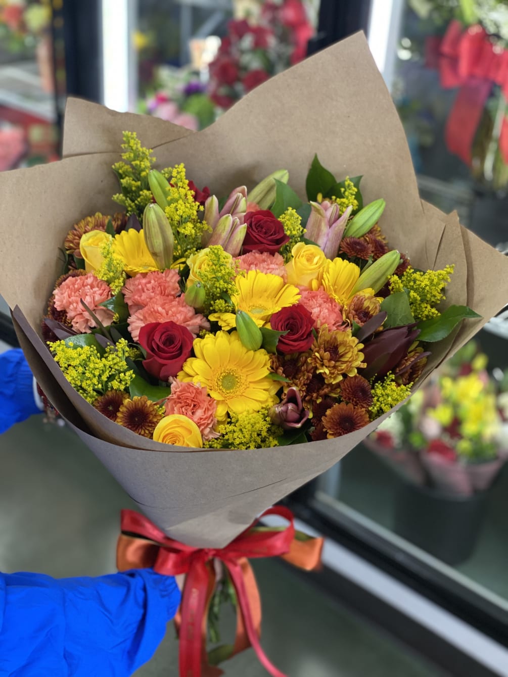A mix of all our fall everyday stocked flowers! 
Wrapped in our