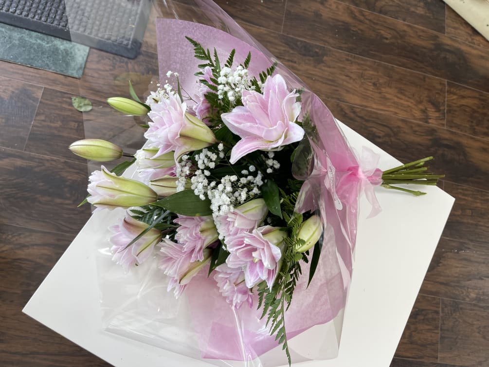 6 double lilies stems, baby breath and greenies that creates a beautiful