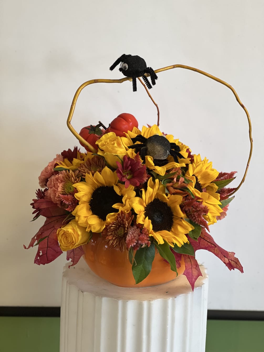 Fall flowers in a pumpkin with a touch of little cute spider!!