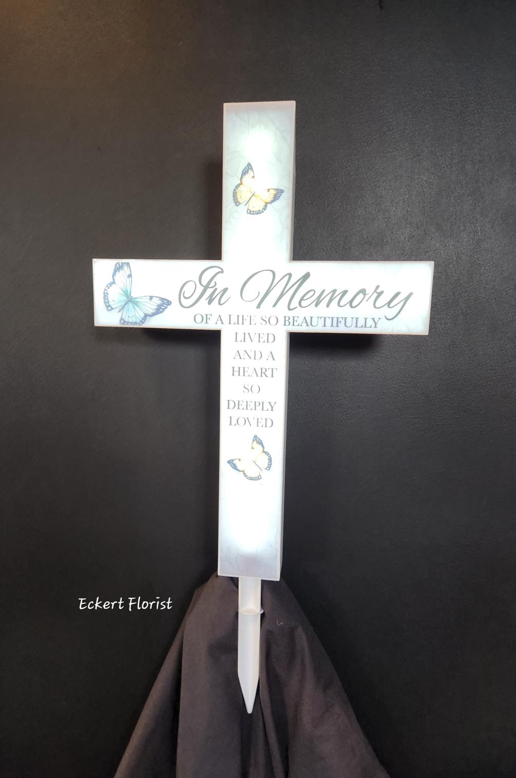 Sentiment on solar lighted cross: &quot;In Loving Memory Of A Life So