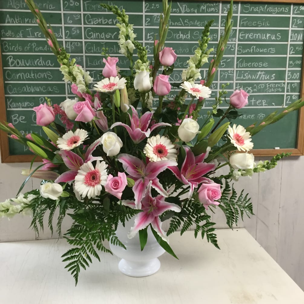 THIS BEAUTIFUL URN OF MOSTLY PINK IS PERFECT FOR FUNERAL