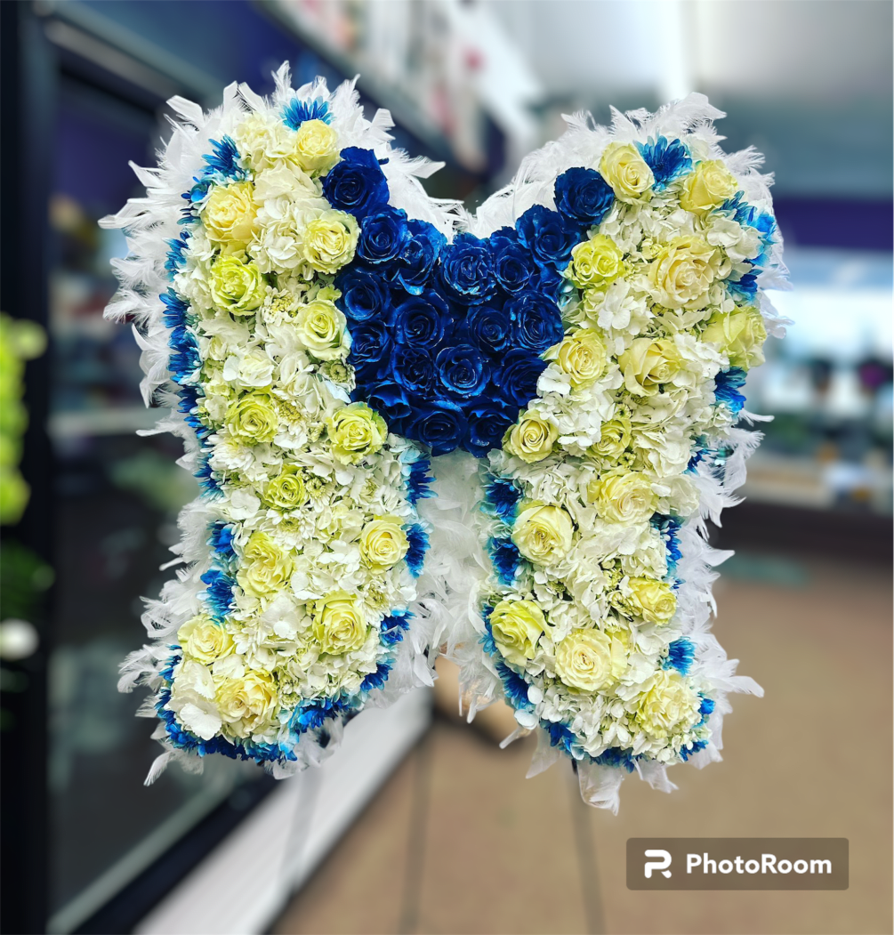 A beautiful wing arrangement for the loved ones. 