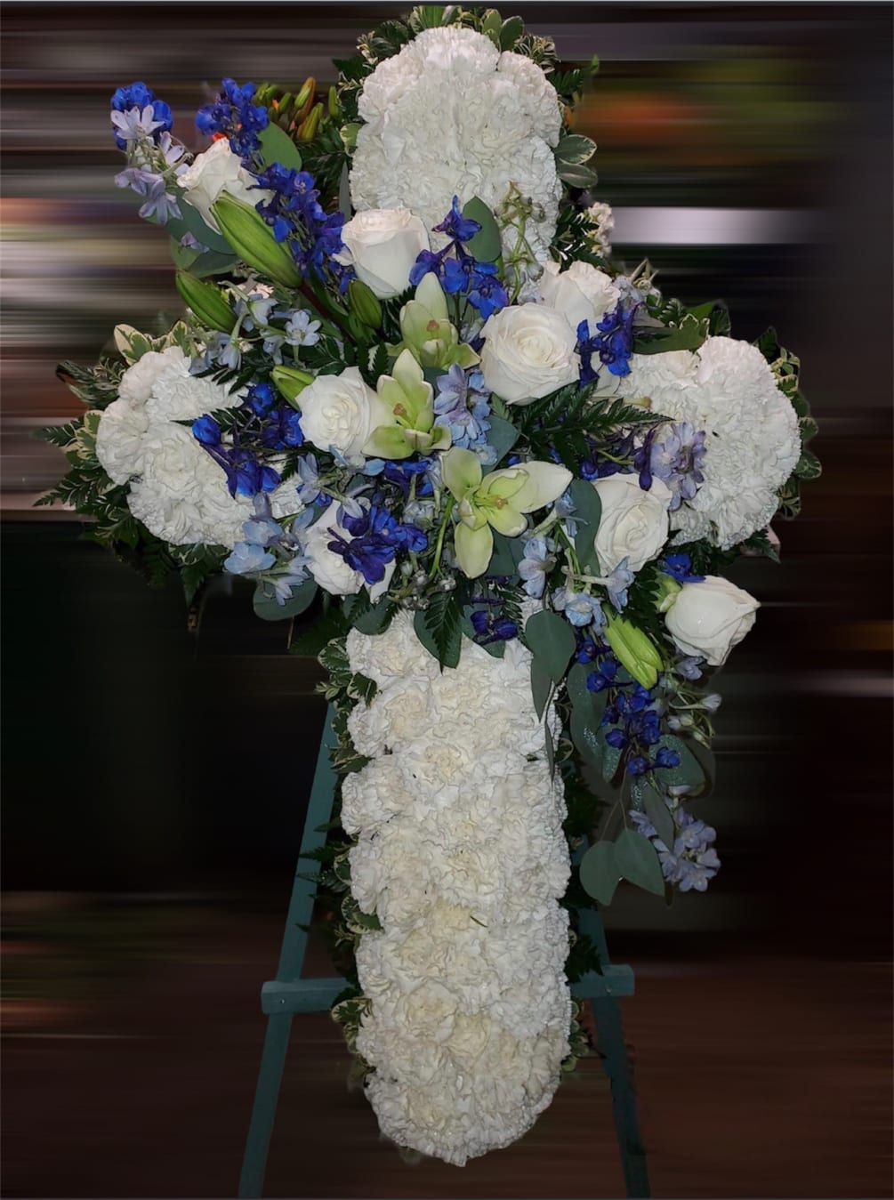 Cross Sympathy arrangement in white and blue colors. 