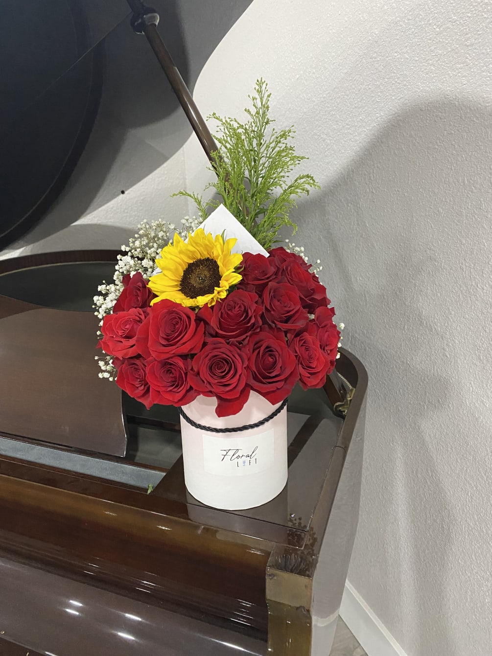 red roses and a sunflower