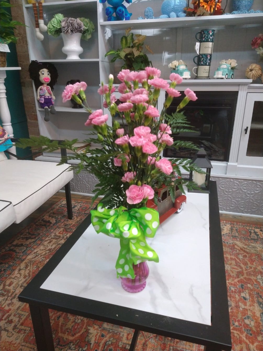 Carnations in glass by Brundidge Florist LLC