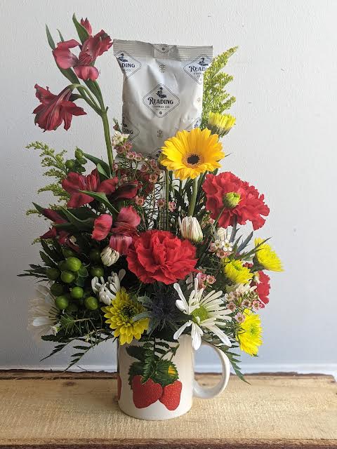 DESIGNER CHOICE ARRANGEMENT 
The flowers will reflect which fruit mug is selected.