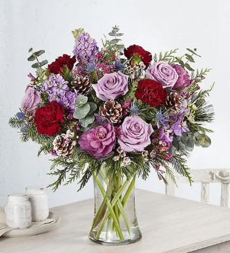 A stunning bouquet of lavender, burgundy and purple blooms, gathered for a