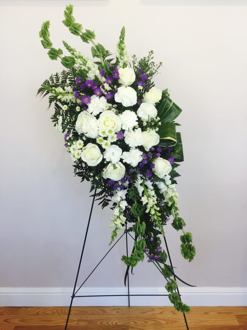 White roses, monte cassino, snapdragon, bells of Ireland and more designed for
