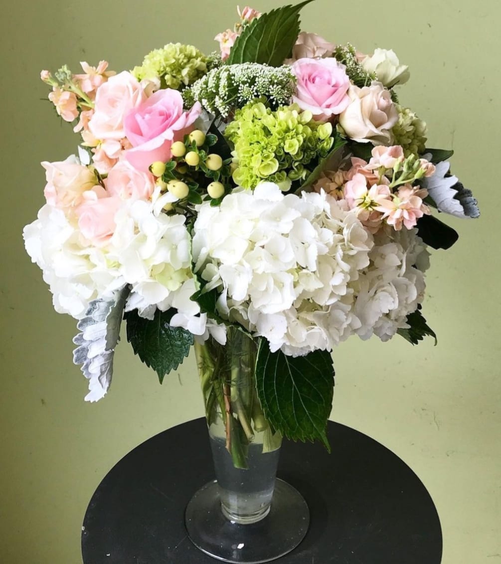 Gorgeous arrangement with roses hydrangeas stock..